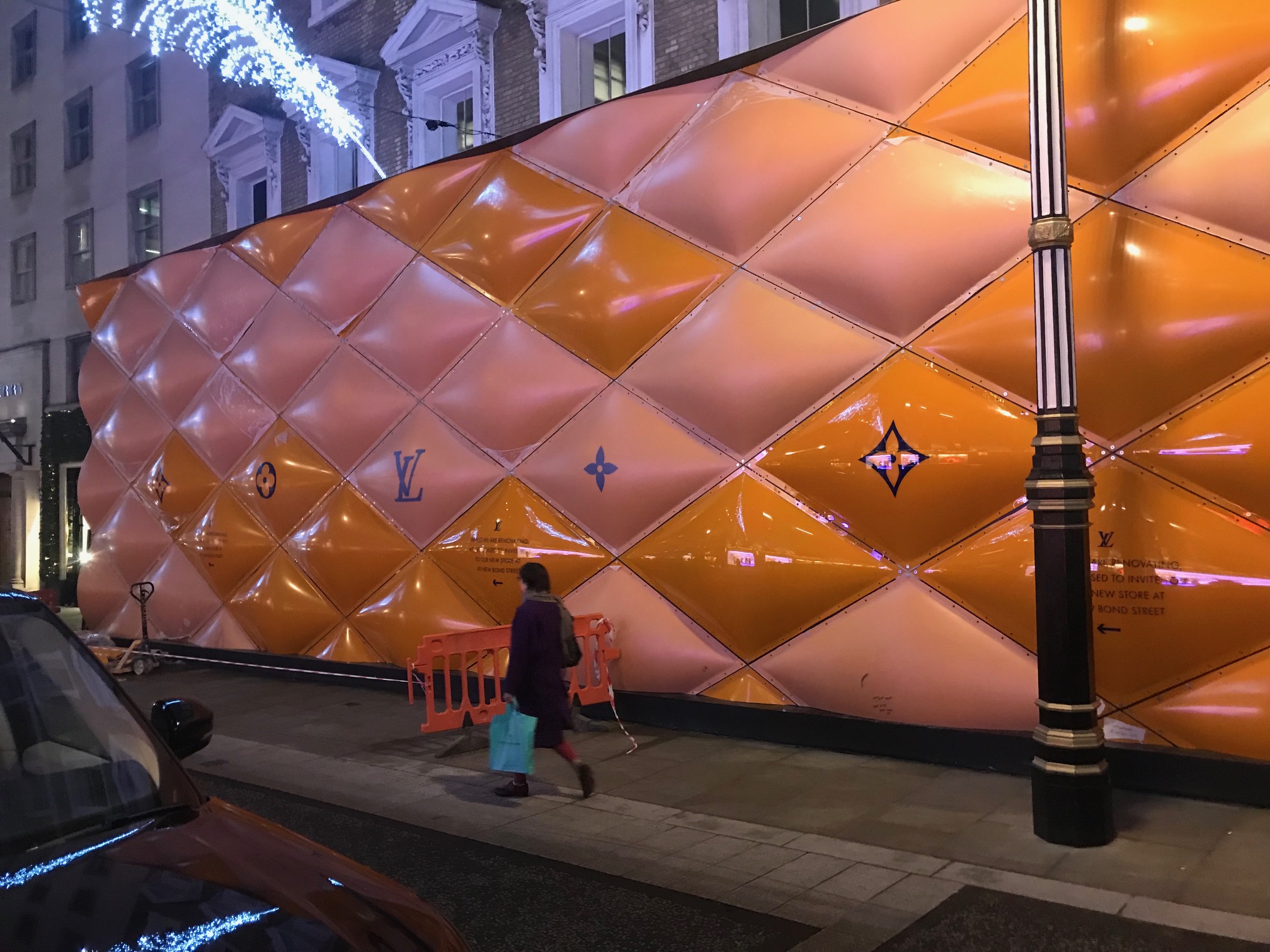 A classically-dressed English gentleman walks past the temporary renovation  hoarding of luxury brand Louis Vuitton in New Bond Street, on 27th February  2019, in London, England Stock Photo - Alamy